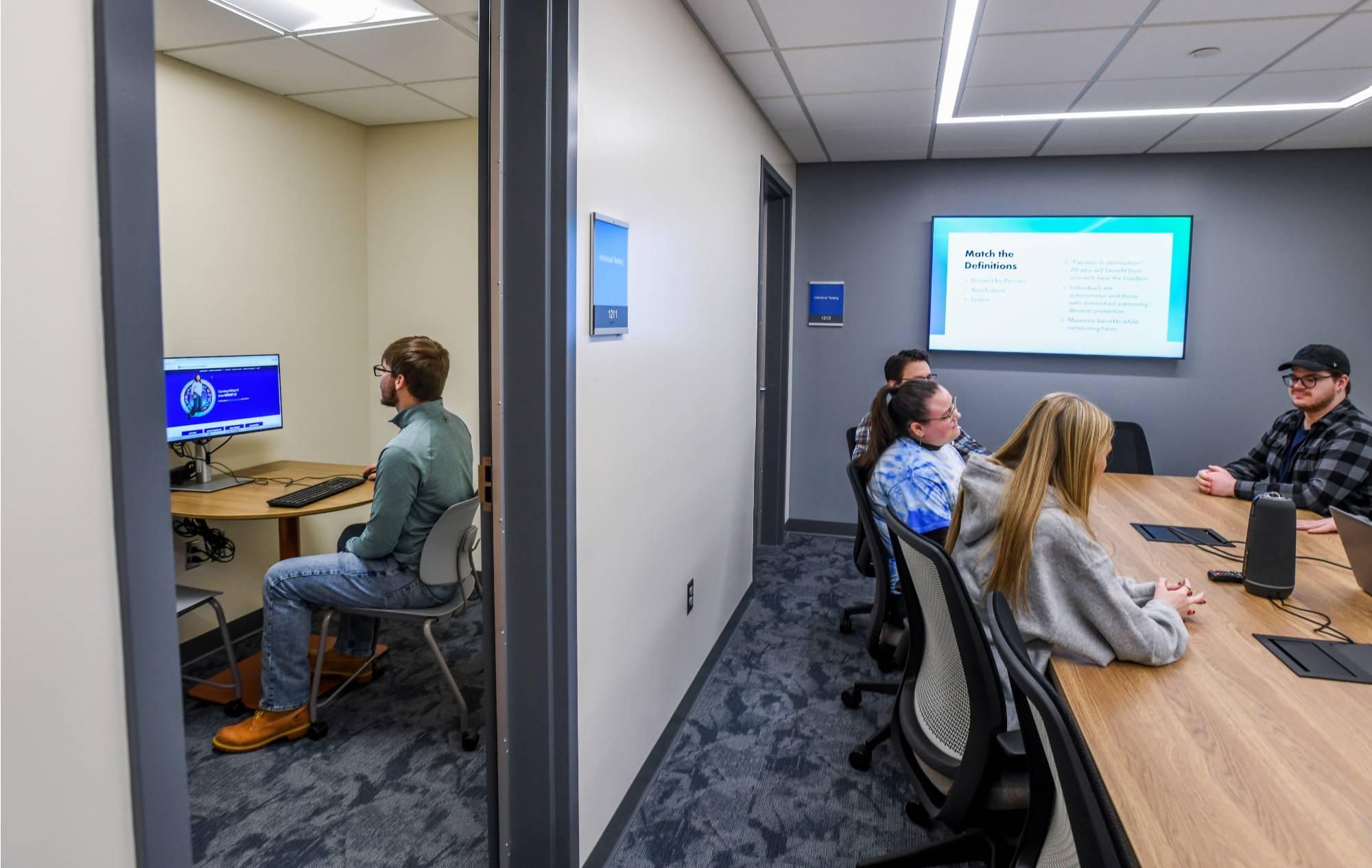 Students participating in a research activity in the Au Sable lab small group room